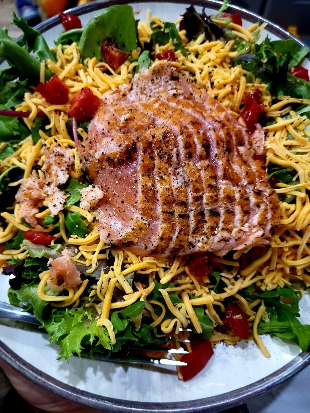 Seared ahi over a fresh mixed-green salad
