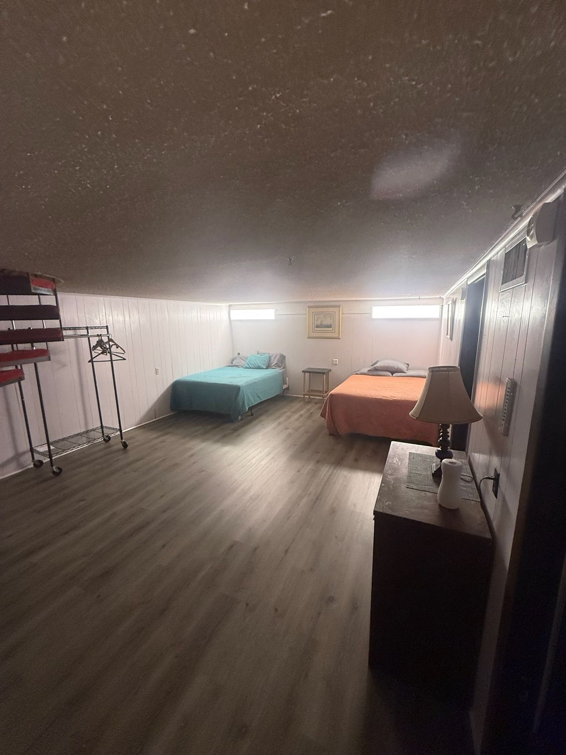 A bedroom with multiple beds at the Canton Lake Lodge