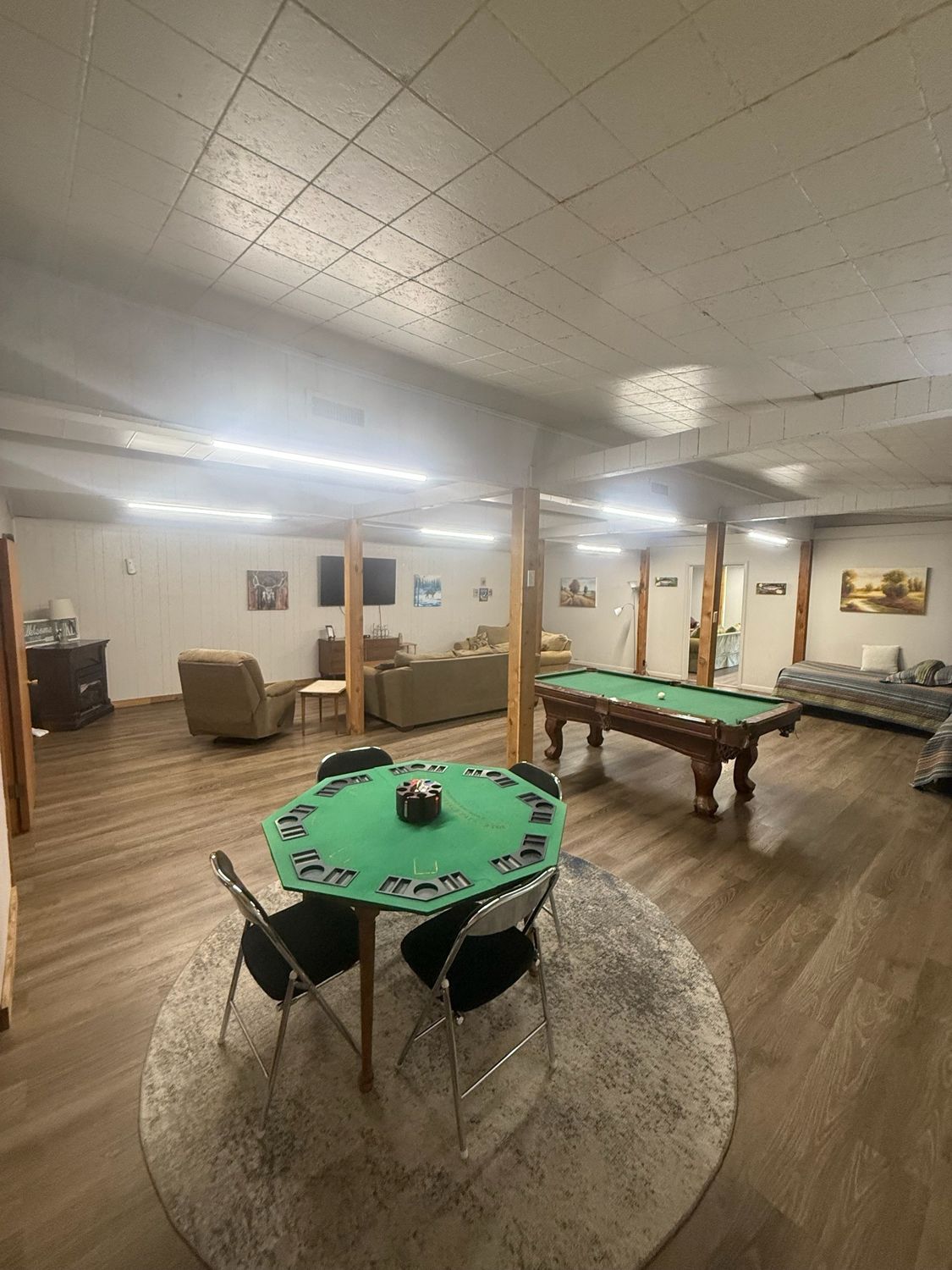 Card table and pool table in the Canton Lake Lodge common area
