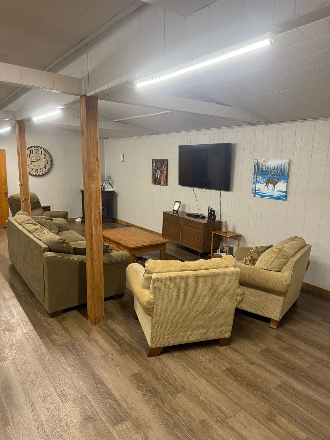 Living area with TV and seating at the Canton Lake Lodge