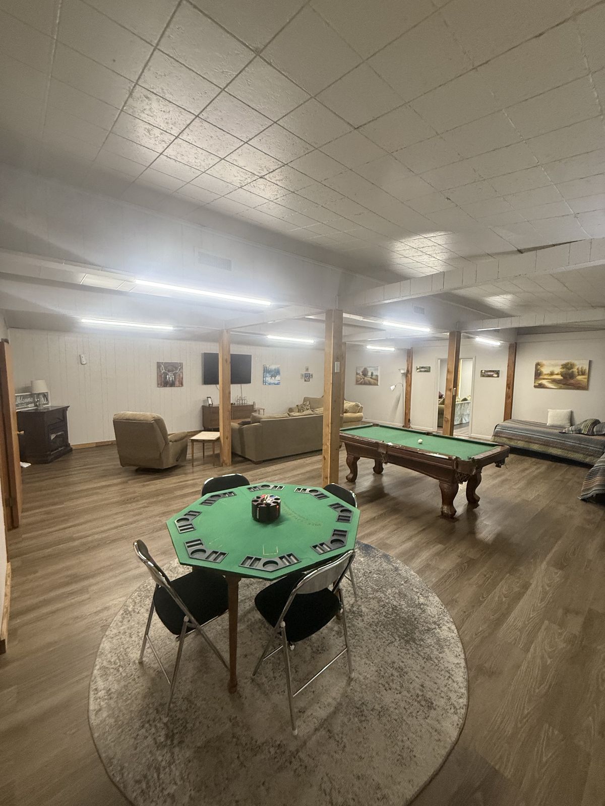 Poker table, pool table and TVs in the Canton Lake Lodge common area
