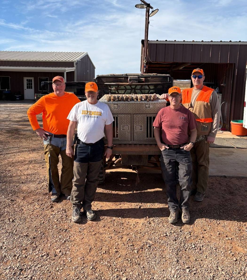 A group back at camp after a day on the ground